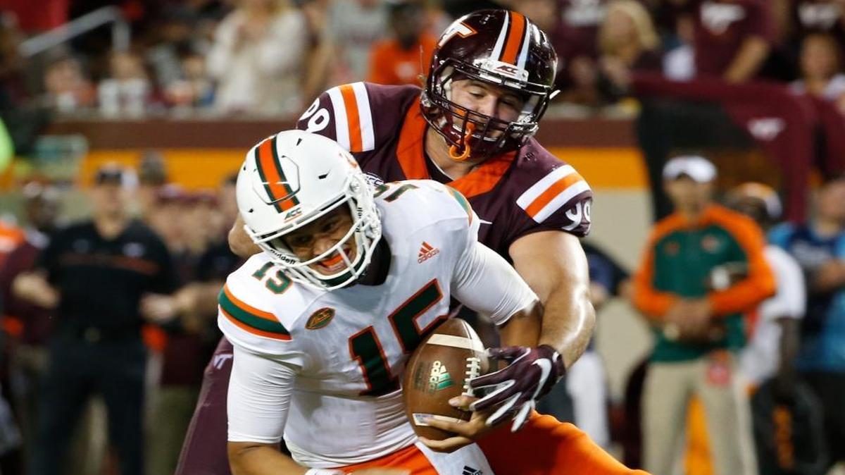 Miami quarterback Brad Kaaya (15) is sacked by Virginia Tech defensive lineman Vinny Mihota (99) during the second half of an NCAA college football game at Lane stadium in Blacksburg, Va., Thurs., Oct. 20, 2016.