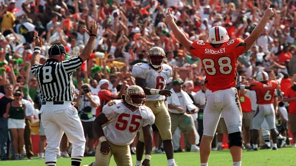 Hurricane tight end Jeremy Shockey raise his arms after scoring the game-winning touchdown in the last minute of the game. University of Miami Hurricanes defeat the Florida State Seminoles 27-24 at the Orange Bowl .