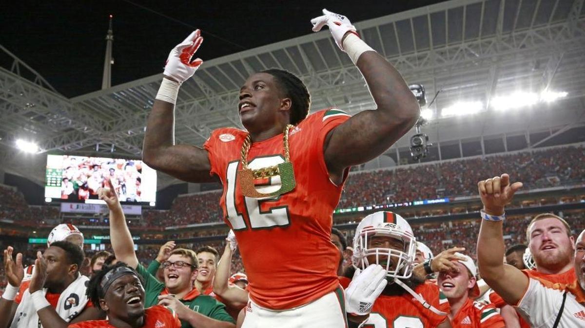 Miami Hurricanes defensive back Malek Young wears the turnover chain after making an interception against Notre Dame at Hard Rock Stadium on Sat., Nov. 11, 2017.