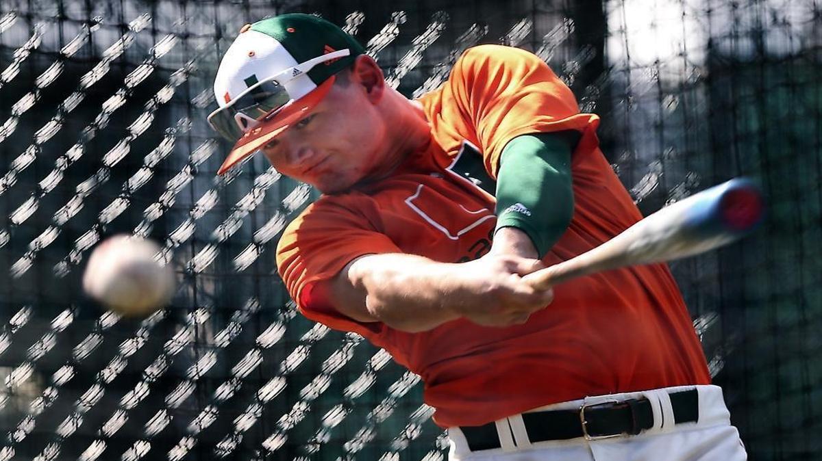 The University of Miami's new right fielder Michael Burns hits balls in the batting cage at Mark Light Field in Coral Gables on Wednesday, Feb. 8, 2017. Burns hit his first grandslam as a Hurricane Sunday, March 12, 2017.