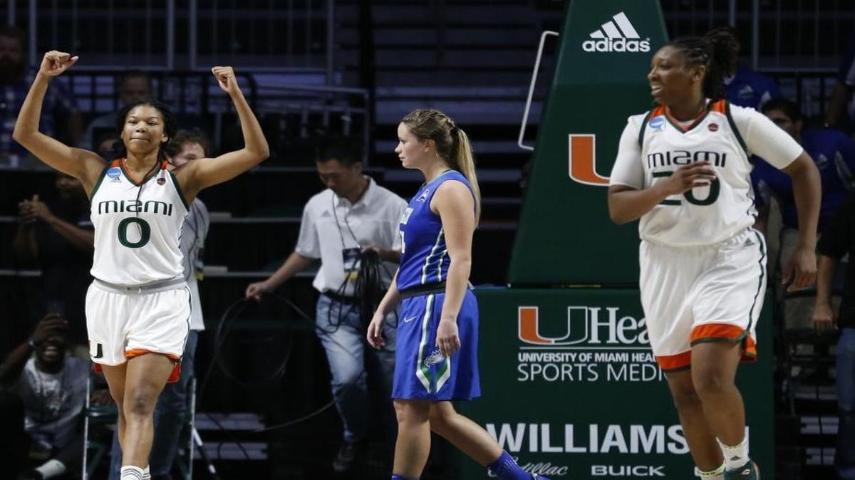 Miami Hurricanes forward Keyanna Harris (0) and forward Keyona Hayes (20) react as the University of Miami women's basketball team defeats Florida Gulf Coast in the NCAA Division 1 Women's Basketball Championship on Saturday, March 18, 2017.