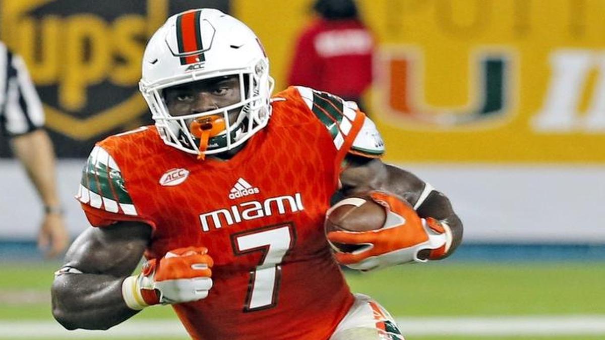 Miami Hurricanes running back Gus Edwards (7) runs for yardage in the fourth quarter as the University of Miami hosts Florida A&M at Hard Rock Stadium on Sat., Sept. 3, 2016.