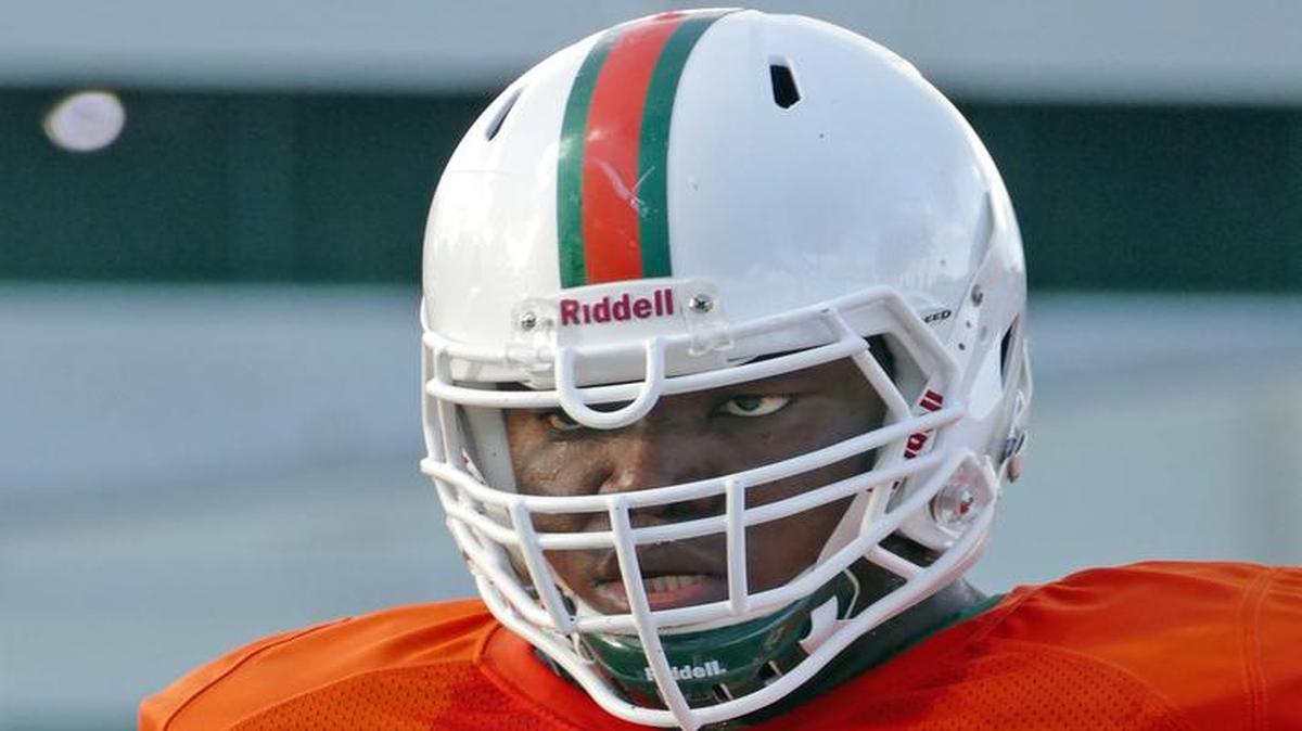 
Offensive lineman Sunny Odogwa is shown at University of Miami football practice Tuesday, Aug. 11, 2015.

