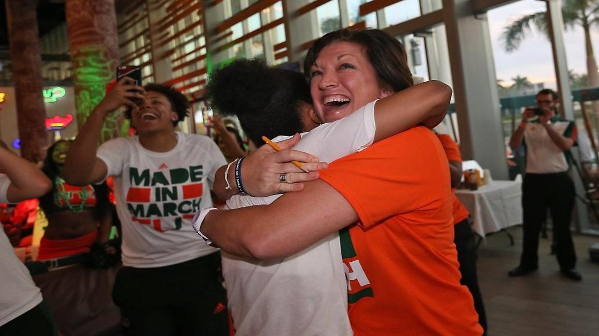 University of Miami coach Katie Meier (at right ) gets a hug from Team Captain Adrienne Motley at the University of Miami Rathskeller on Mon., March 14, 2016, as they find out they will be a 5 seed and play South Dakota State in the NCAA Women's Tournament.