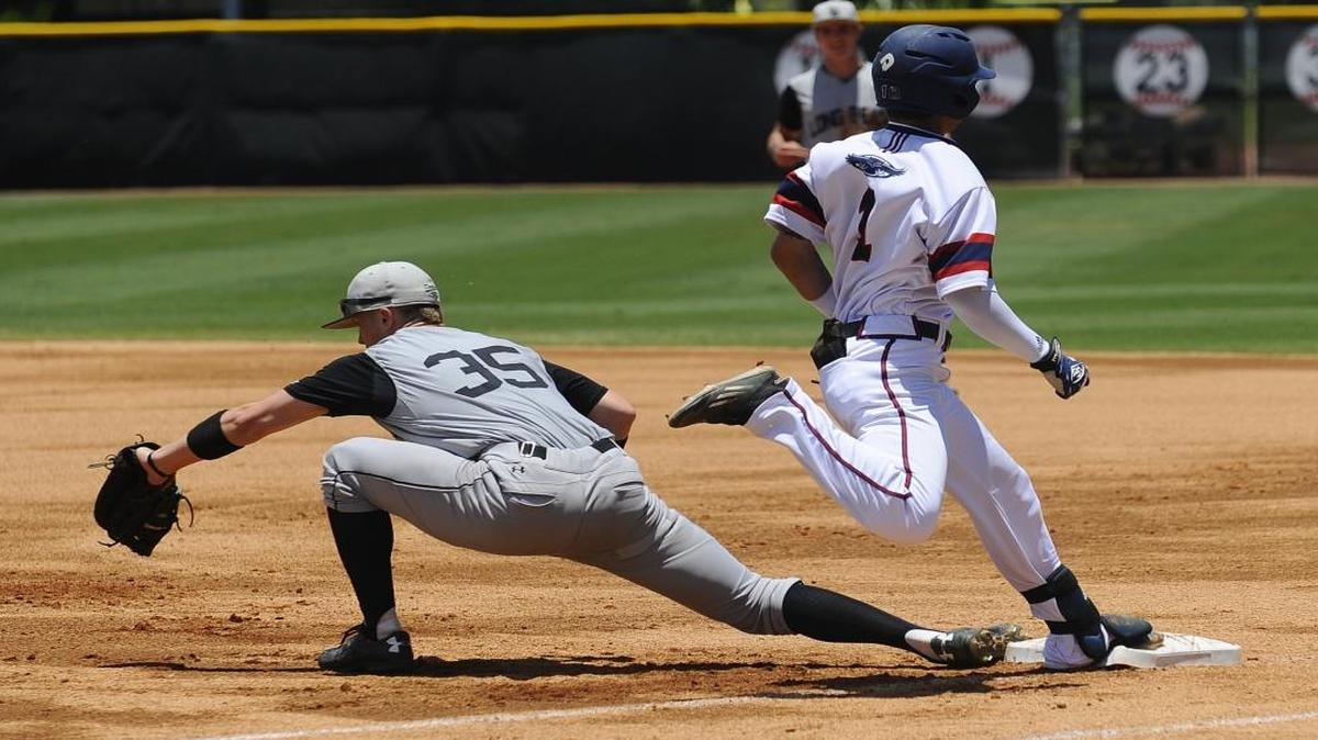 Florida Atlantic infielder Stephen Kerr (1) is narrowly thrown out at first by Long Beach St. first baseman Daniel Jackson (35) during the first game of the NCAA Regionals held at Mark Light Field on Fri., June 3, 2016.