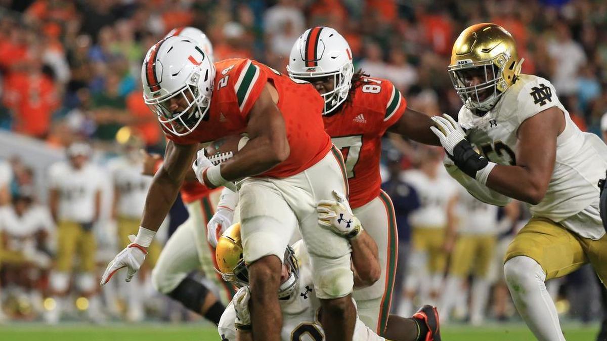 Miami Hurricanes running back Travis Homer runs against Notre Dame at Hard Rock Stadium on Saturday, Nov. 11, 2017. The Canes take on LSU in the season opener at AT&T stadium on Sept. 2, 2018.