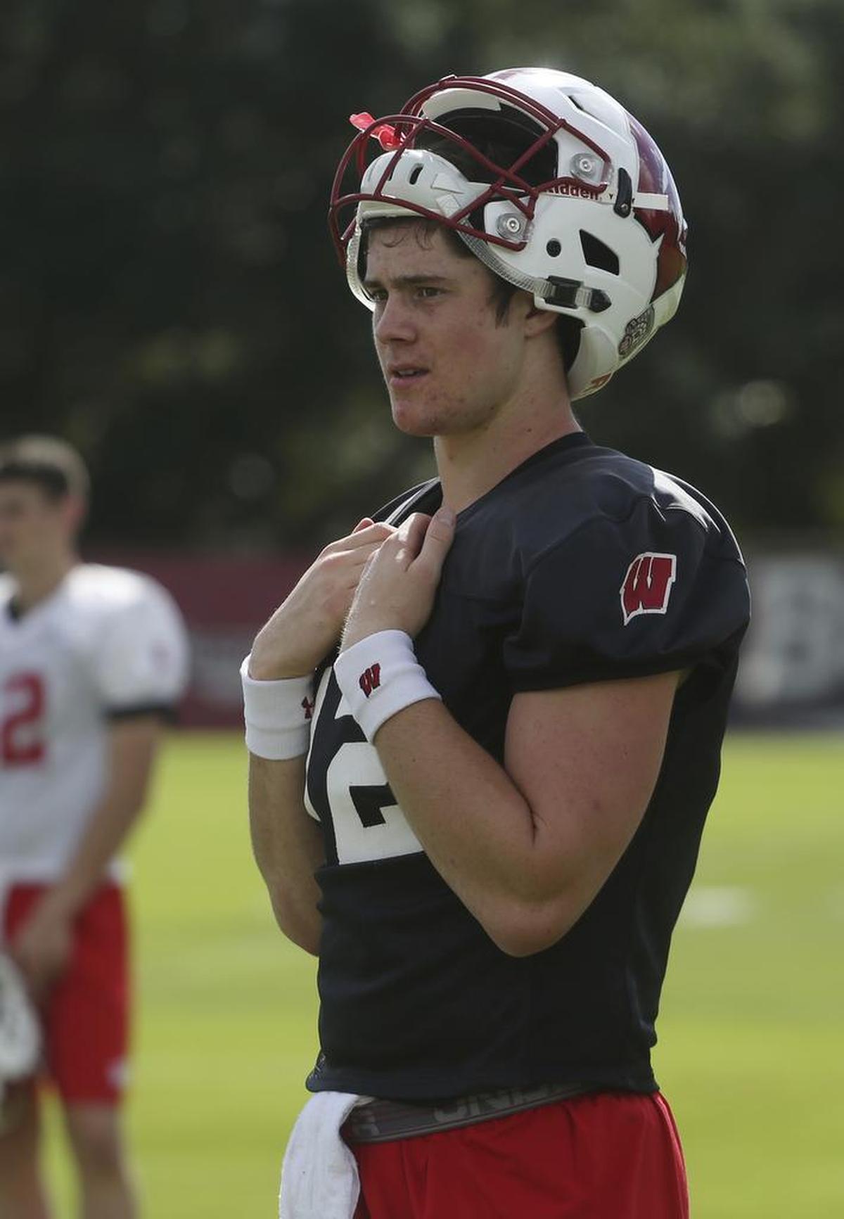 Wisconsin quarterback Alex Hornibrook, a second-year starter, leads a passing game that averages only 187 yards, ninth-best in the Big 10. Here he is watching his team practice in Miami Shores on Wednesday.