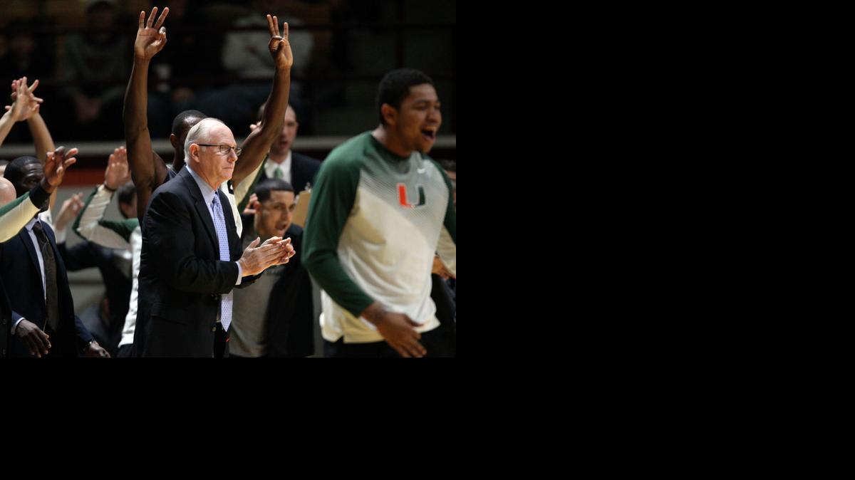 
Miami head coach Jim Larranaga celebrates a 3-point basket with his team during the first half of an NCAA college basketball game against Virginia Tech in Blacksburg, Va. on March 7, 2015.
