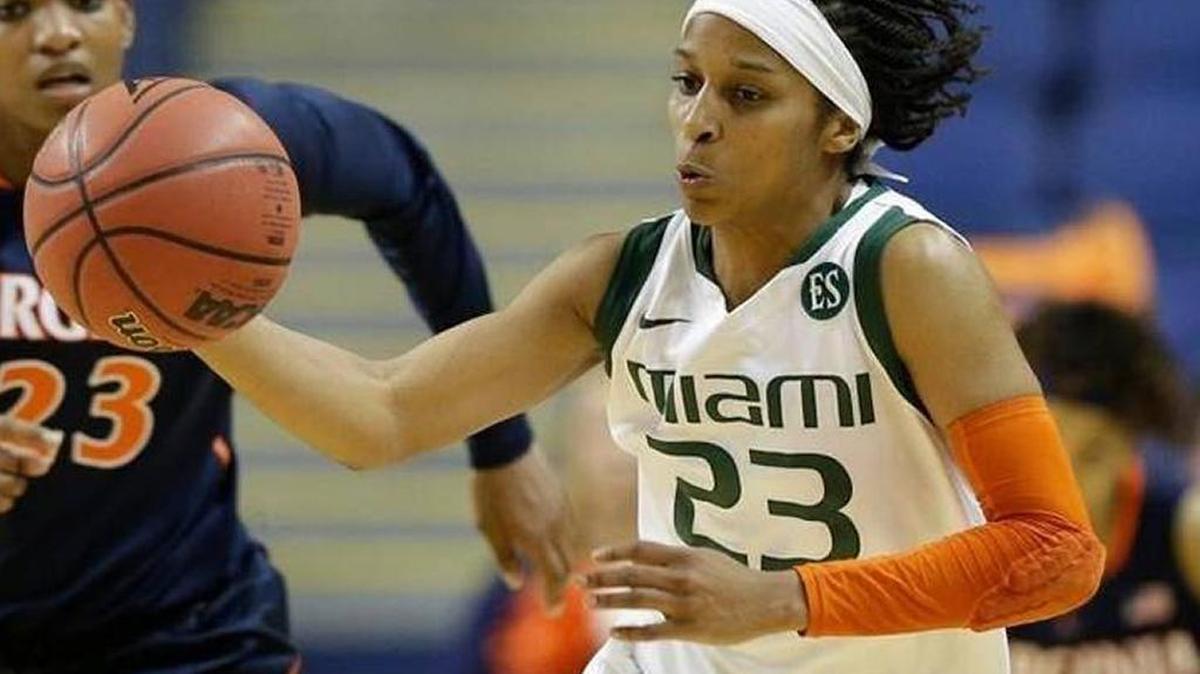 Adrienne Motley (right) is one of three seniors on the University of Miami team to have scored 1,000 career points.Chuck Burton.