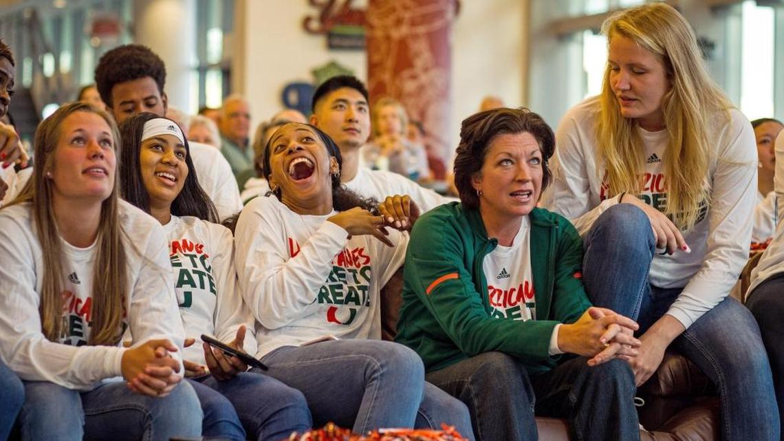 From left to right University of Miami Women’s Basketball players Laura Cornelius, Shaneese Bailey, Erykah Davenport, headcoach Katie Maier, and Emefe Hof react at the NCAA basketball selection show viewing party at the Rathskellar on UM's Coral Gables on Monday, March 12, 2018. The team is in the NCAA Tournament for the fourth year in a row, and faces Quinnipiac in the first-round Saturday Mar. 17 in Storrs, Conn.