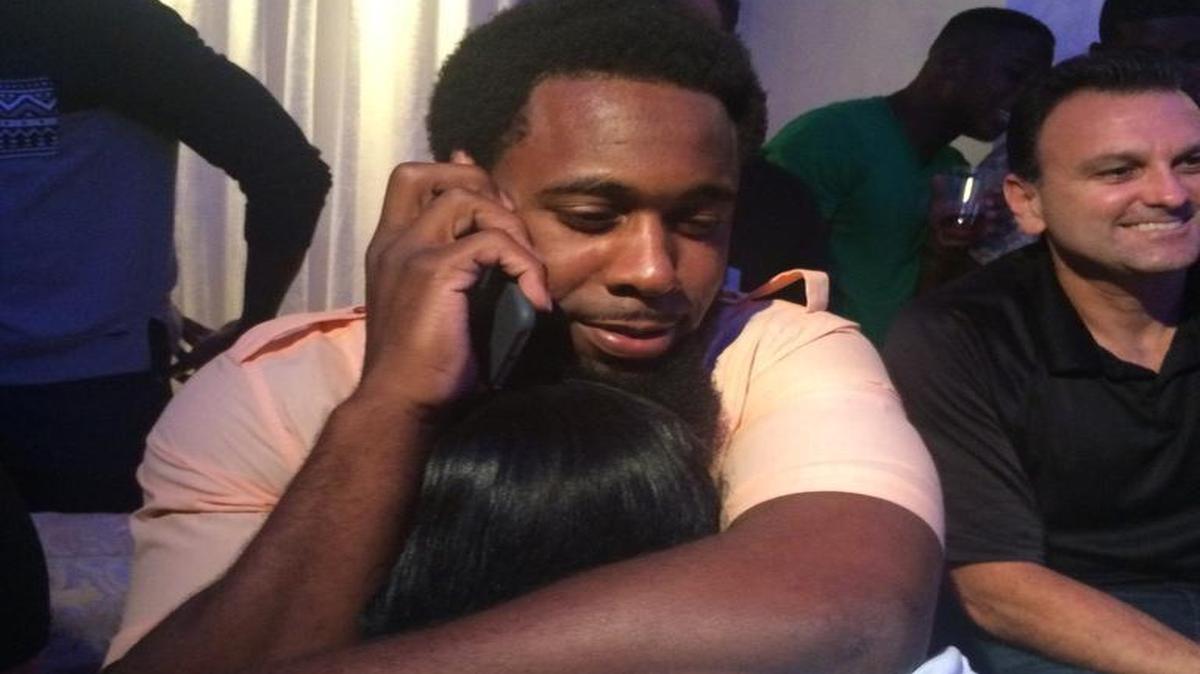 
Former UM tight end Clive Walford embraces his mother as he gets a call from the Oakland Raiders confirming they will draft him 68th overall in the third round of the NFL Draft. 
