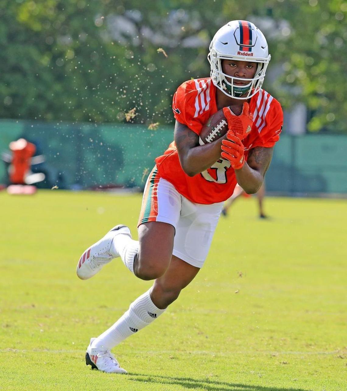 Wide receiver Mike Harley (3) runs drills as the University of Miami opens fall football camp at Greentree Field on Tuesday, Aug. 1, 2017.