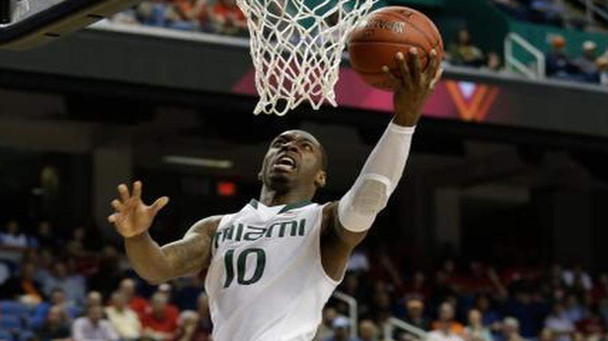 
UM’s Sheldon McClellan drives past Virginia Tech’s Satchel Pierce during an ACC tournament game in Greensboro, N.C., Wednesday, March 11, 2015.
