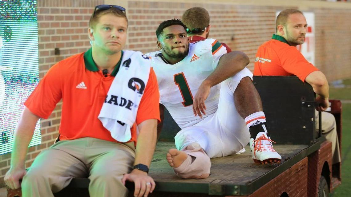 Miami Hurricanes running back Mark Walton (1) is carting off in the fourth quarter with an injury as the Seminoles host the Miami Hurricanes at Doak Campbell Stadium in Tallahassee on Saturday, Oct. 7, 2017.