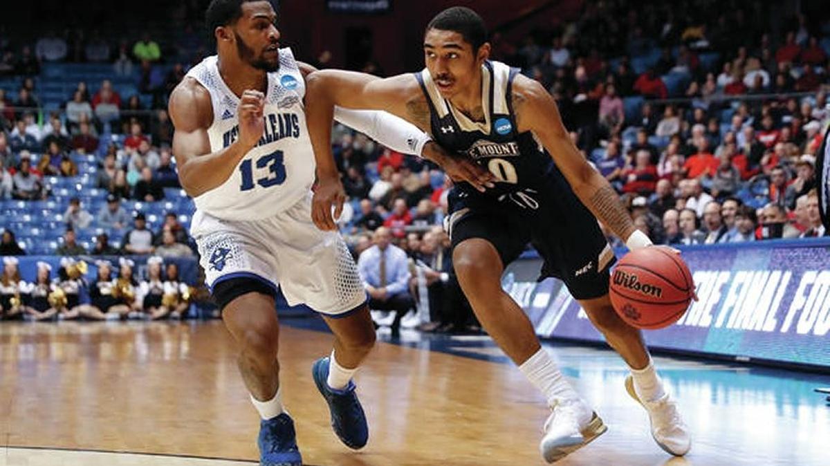Mount St. Mary’s guard Miles Wilson (right) is transfering and says he is choosing between the University of Miami and Auburn.