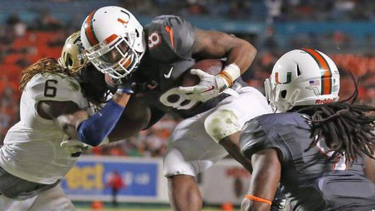 
Duke Johnson, scoring a touchdown during the third quarter, became the Canes’ all-time leading rusher on Saturday night.
