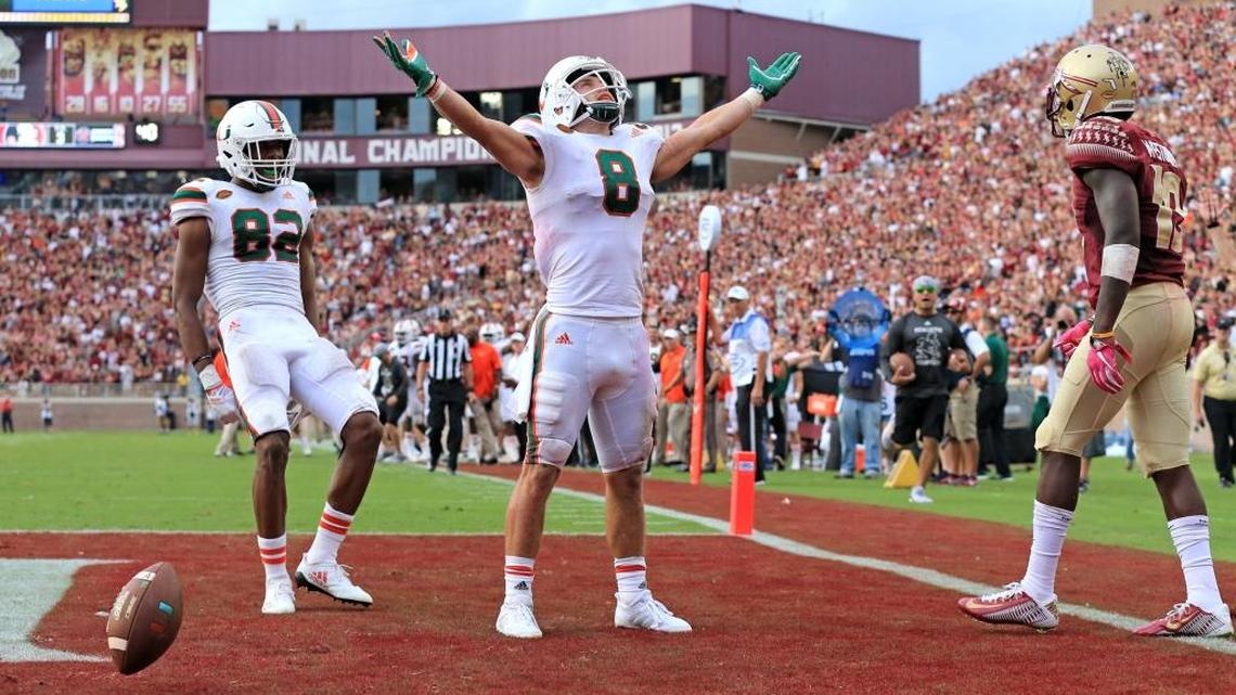 Miami Hurricanes wide receiver Braxton Berrios scores against Florida State at Doak Campbell Stadium in Tallahassee on Saturday, October 7, 2017.
