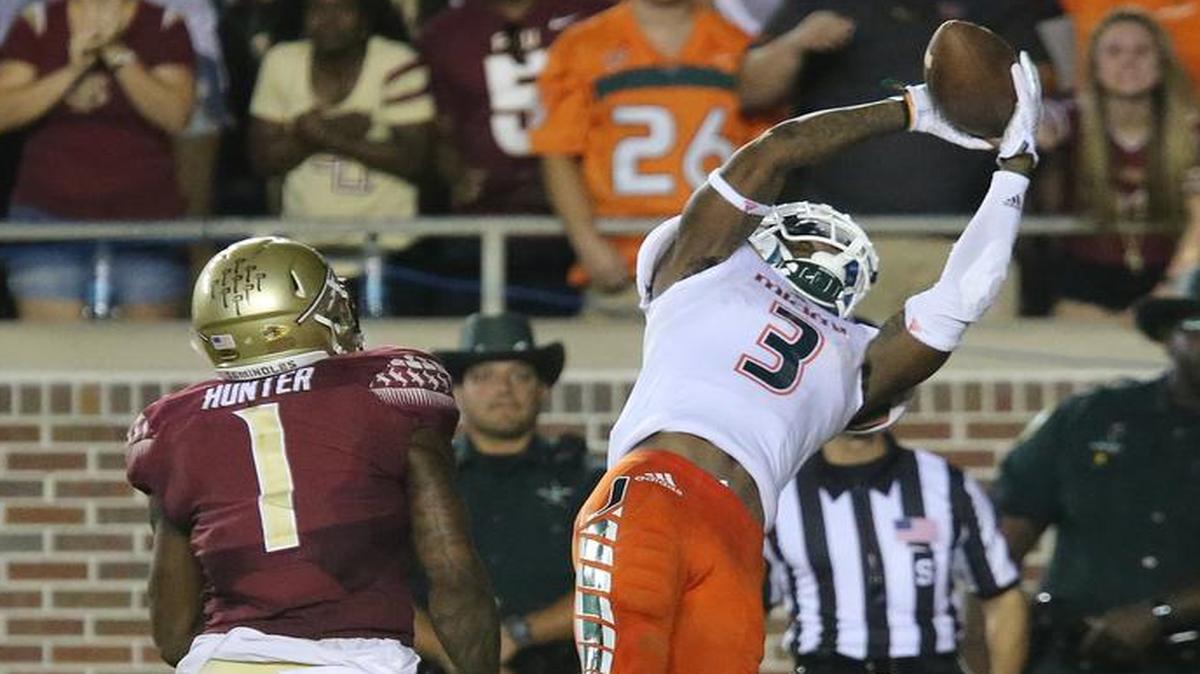 
Miami's Stacy Coley goes up over Florida State's Tyler Hunter to take the lead in the fourth quarter of an NCAA college football game, Saturday, Oct. 10, 2015 in Tallahassee, Fla. Florida State won the game 29-24. 
