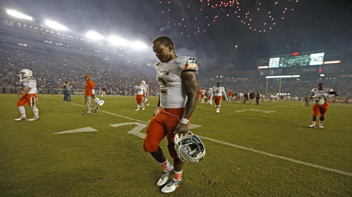 
A dejected Miami Hurricanes running back Joseph Yearby (2) walks off the field as Miami loses 29-24 as Florida State University hosts the University of Miami at Doak Campbell Stadium in Tallahassee on Saturday, October 10, 2015.
