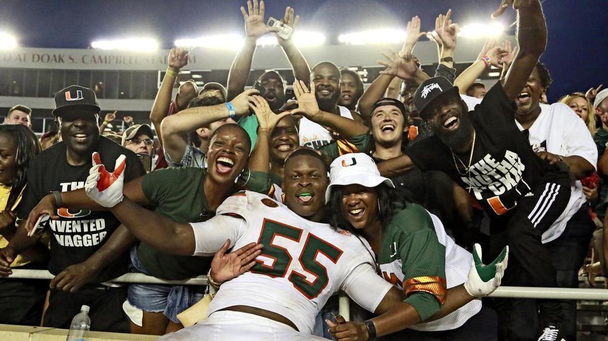 Miami Hurricanes linebacker Shaquille Quarterman celebrates with fans after defeating the Seminoles at Doak Campbell Stadium in Tallahassee on Saturday, October 7, 2017. It was the first of back-to-back, last-second victories for Miami.