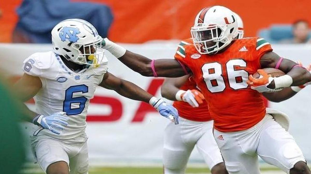 Miami Hurricanes tight end David Njoku (86) on a reception as North Carolina Tar Heels cornerback M.J. Stewart (6) defends as the University of Miami Hurricanes host the University of North Carolina Tar Heels at Hard Rock Stadium on Sat., Oct. 15, 2016.