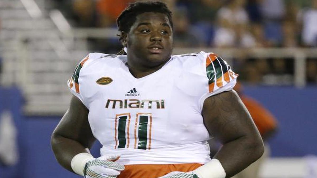 Miami defensive lineman Michael Wyche walks off the field at the end of the first half against Florida Atlantic, Friday, Sept. 11, 2015, in Boca Raton, Fla.