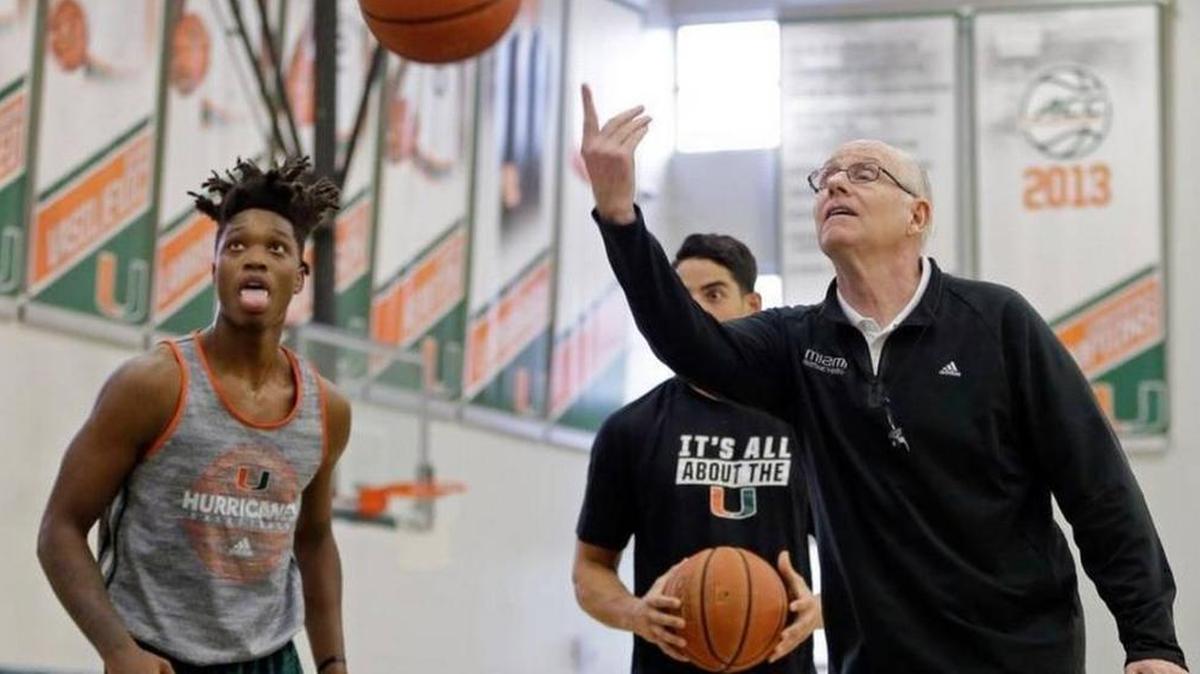 Freshman guard Lonnie Walker IV, left, at practice with University of Miami basketball coach Jim Larrañaga.