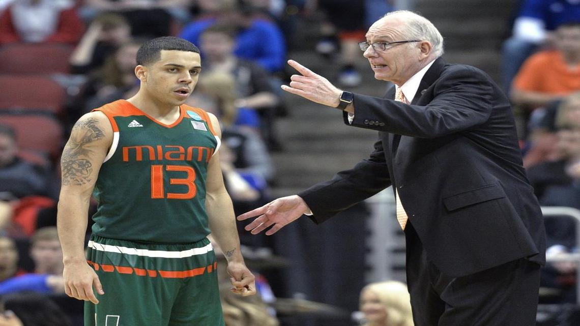 Miami coach Jim Larrañaga talks with guard Angel Rodriguez, (13) who transferred to the University of Miami from Kansas State in 2013.