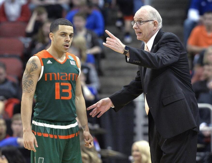 Miami coach Jim Larrañaga talks with guard Angel Rodriguez, (13) who transferred to the University of Miami from Kansas State in 2013.