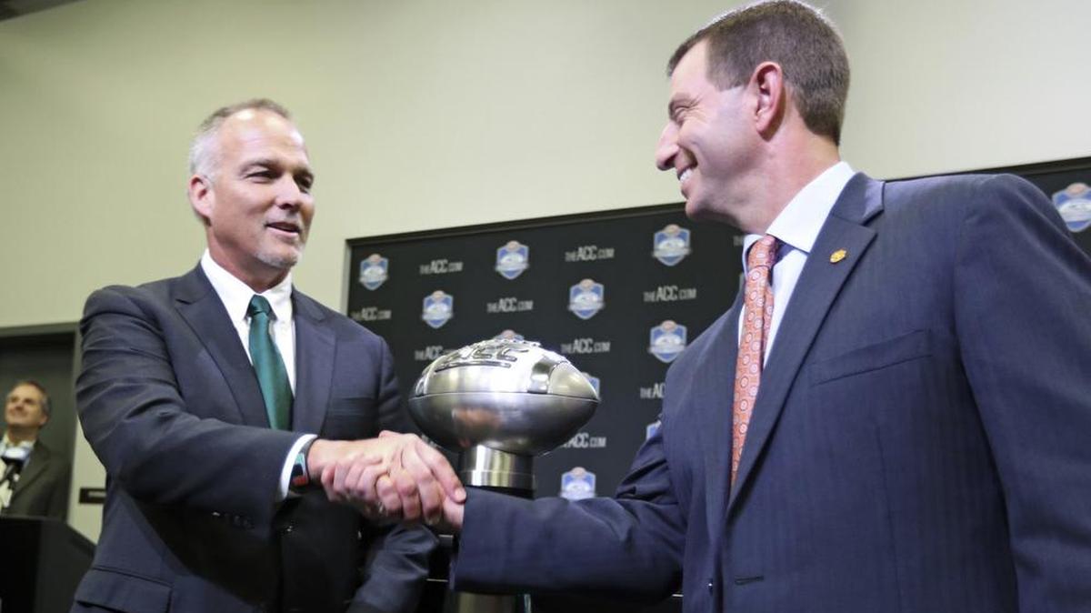 Miami Hurricanes head coach Mark Richt and Clemson head coach Dabo Swinney during a press conference at Bank of America Stadium on Friday, December 1, 2017.