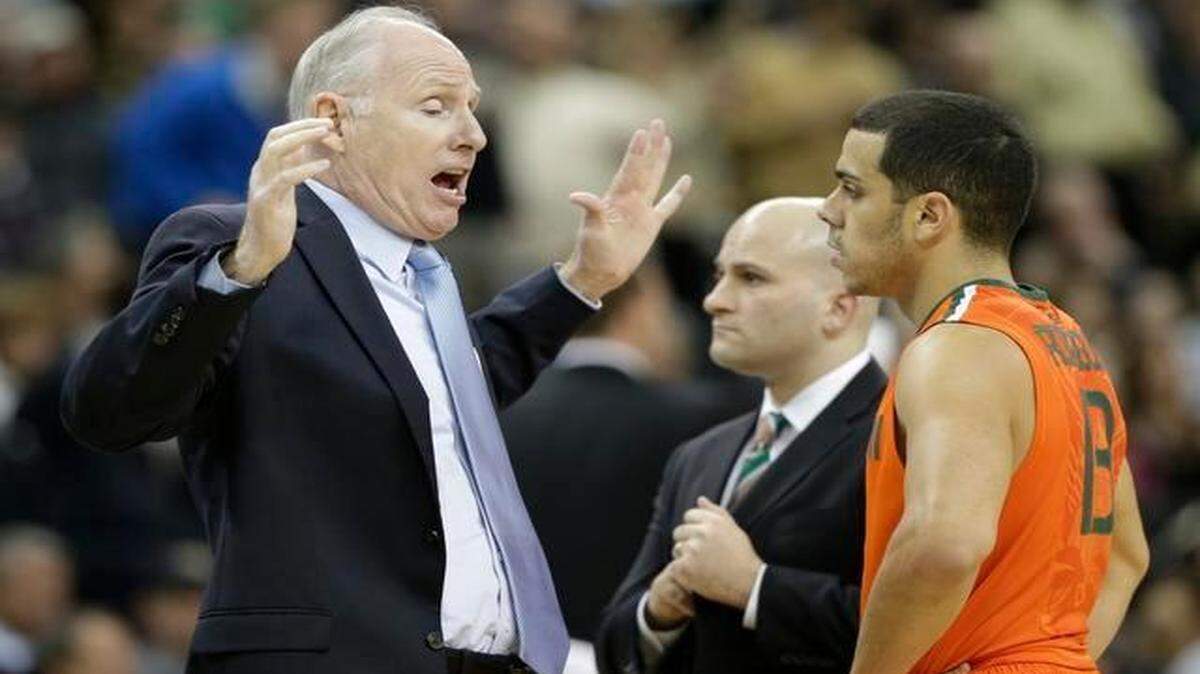 
Miami head coach Jim Larrañaga, left, talks with Angel Rodriguez during a game against Wake Forest in Winston-Salem, N.C., Wednesday, Feb. 11, 2015. 
