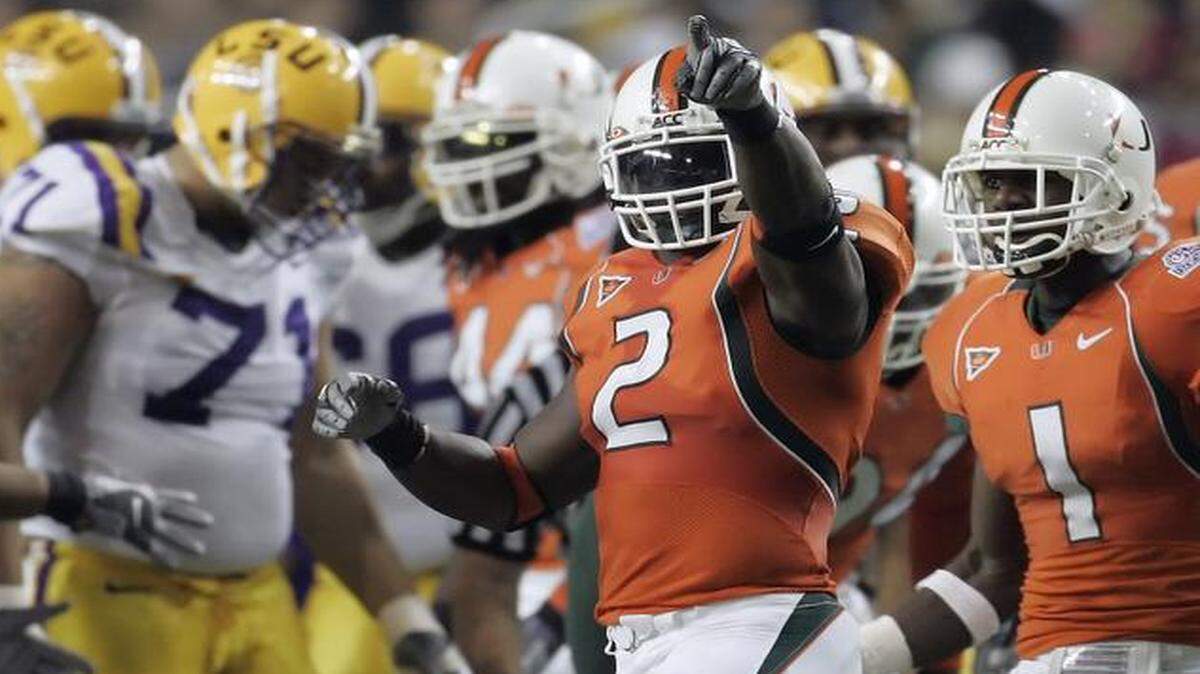 
UM linebacker Jon Beason (2) reacts after stopping LSU running back Joseph Addai for a loss in the second quarter of the Peach Bowl at the Georgia Dome in Atlanta on Friday, Dec. 30, 2005. 
