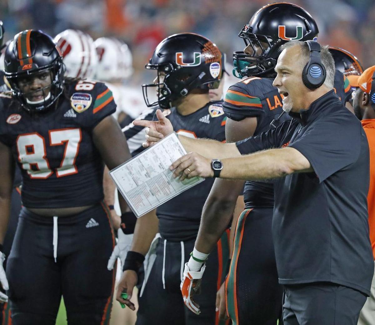 The Miami Hurricanes, shown with head coach Mark Richt, played in the Orange Bowl last season. They await their bowl invitation for 2018.