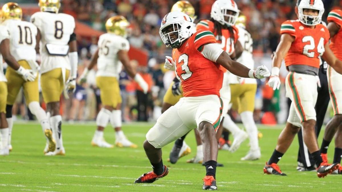 Miami Hurricanes running back DeeJay Dallas (13) reacts after taking down Notre Dame Fighting Irish wide receiver Chris Finke (10) on a punt return in their game on Nov. 11. Offensive coordinator Thomas Brown said UM wants to get the ball more in Dallas’ hands.