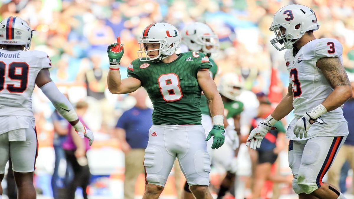 Miami Hurricanes wide receiver Braxton Berrios signals a first down against the Virginia Cavaliers at Hard Rock Stadium on Saturday, November 18, 2017.