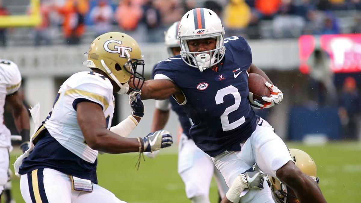 Joe Reed #2 of the Virginia Cavaliers stiff-arms Lance Austin #17 of the Georgia Tech Yellow Jackets in the first quarter during a game at Scott Stadium on Nov. 4, 2017 in Charlottesville, Virginia.