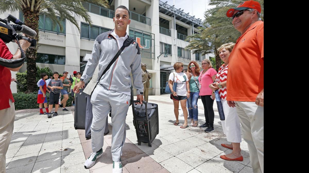 
UM outfielder Willie Abreu departs Mark Light Field during a sendoff for the Hurricanes baseball team in Coral Gables on Wednesday, June 10, 2015. The Hurricanes are heading to Omaha, Nebraska, for the College World Series.
