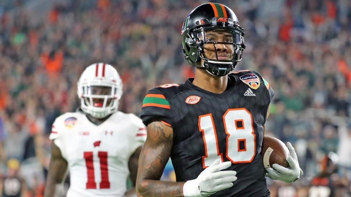 Miami Hurricanes receiver Lawrence Cager catches a touchdown pass against Wisconsin in the Orange Bowl. He’s competing for a starting job.