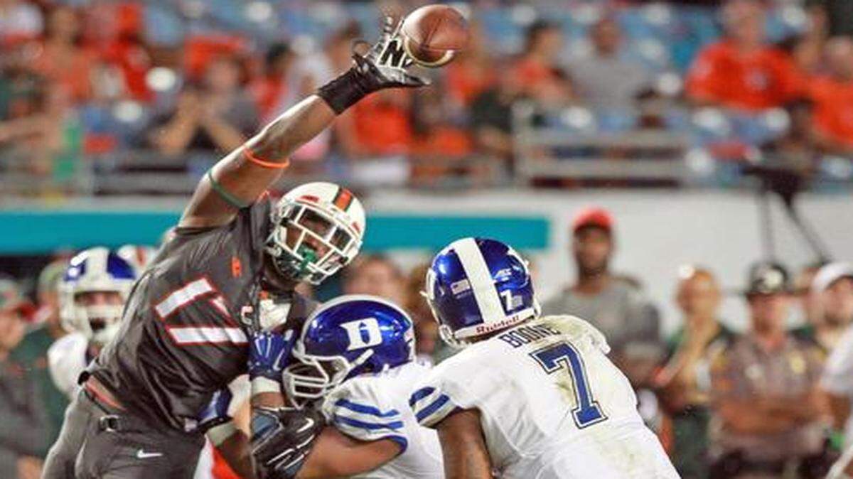 
UM’s Tyriq McCord (17) defends a pass against Duke at Sun Life Stadium on Sept. 27, 2014.
