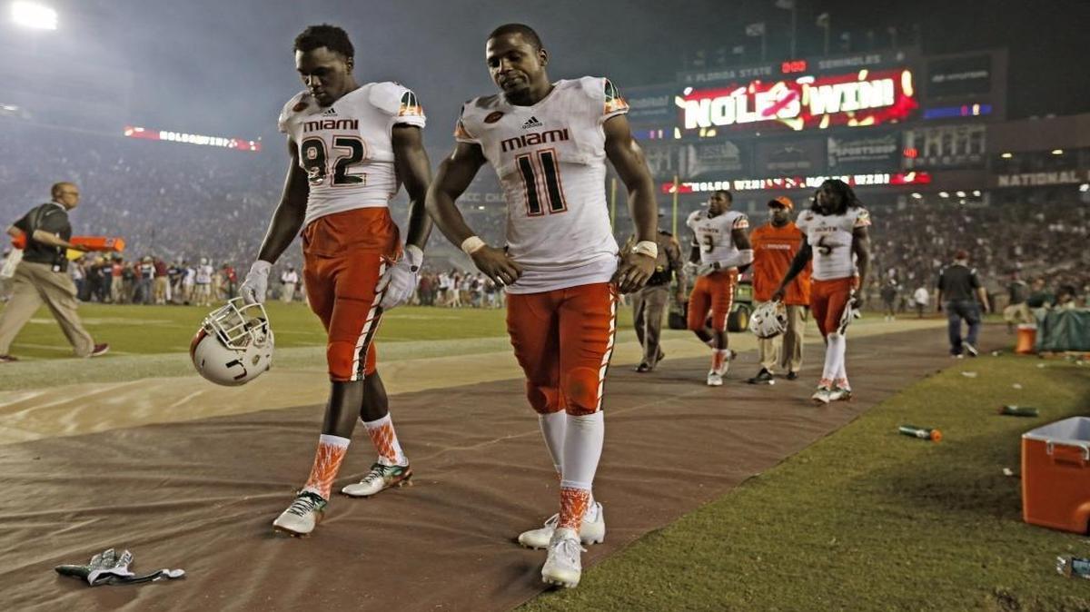 
UM wide receivers Tyre Brady (82) and Rashawn Scott (11) walk off the field after losing 29-24 to FSU at Doak Campbell Stadium in Tallahassee on Saturday, October 10, 2015.
