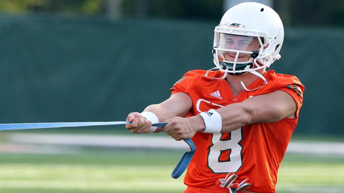 
Wide receiver Braxton Berrios participates in a resistance drill on Day 1 of fall camp Thursday, Aug. 6, 2015 at Greentree Practice Field in Coral Gables.
