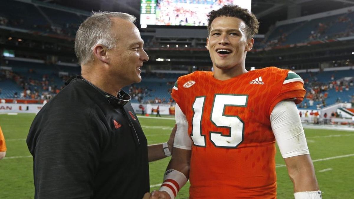 Miami Hurricanes head coach Mark Richt with Miami Hurricanes quarterback Brad Kaaya (15) on the field after the University of Miami defeats Duke at Hard Rock Stadium in Miami Gardens on Sat., Nov. 26, 2016