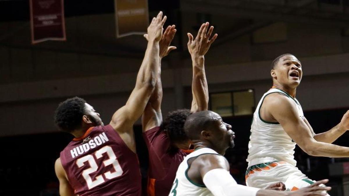 Miami guard James Palmer (12) goes to the basket against Virginia Tech during the first half of an NCAA college basketball game on Feb. 17, 2016, in Coral Gables.