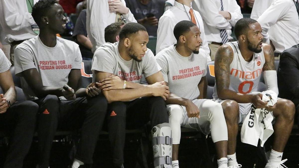 UM Hurricanes basketball players wear warmup shirts honoring victims of Stoneman Douglas High School shooting during the NCAA men's basketball game against Syracuse Orange on Saturday, Feb. 17, 2018, at Watsco Center in Coral Gables.