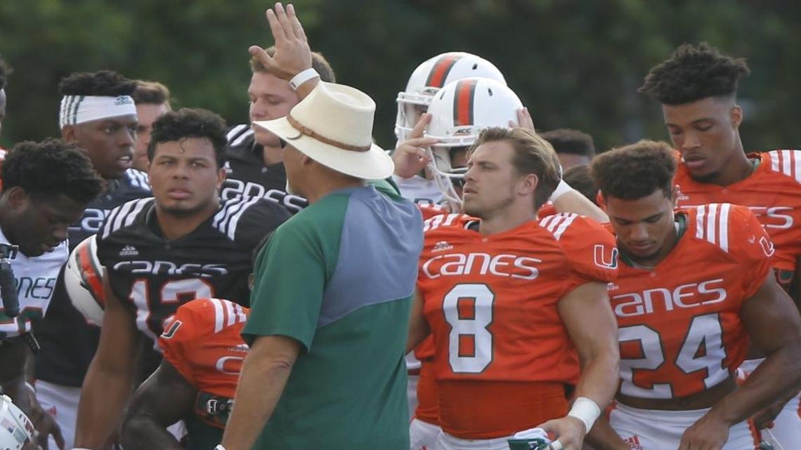University of Miami coach Mark Richt addresses the team during practice on Tues., Aug. 22, 2017. Richt named Malik Rosier, #12, left, starting quarterback for the upcoming season.