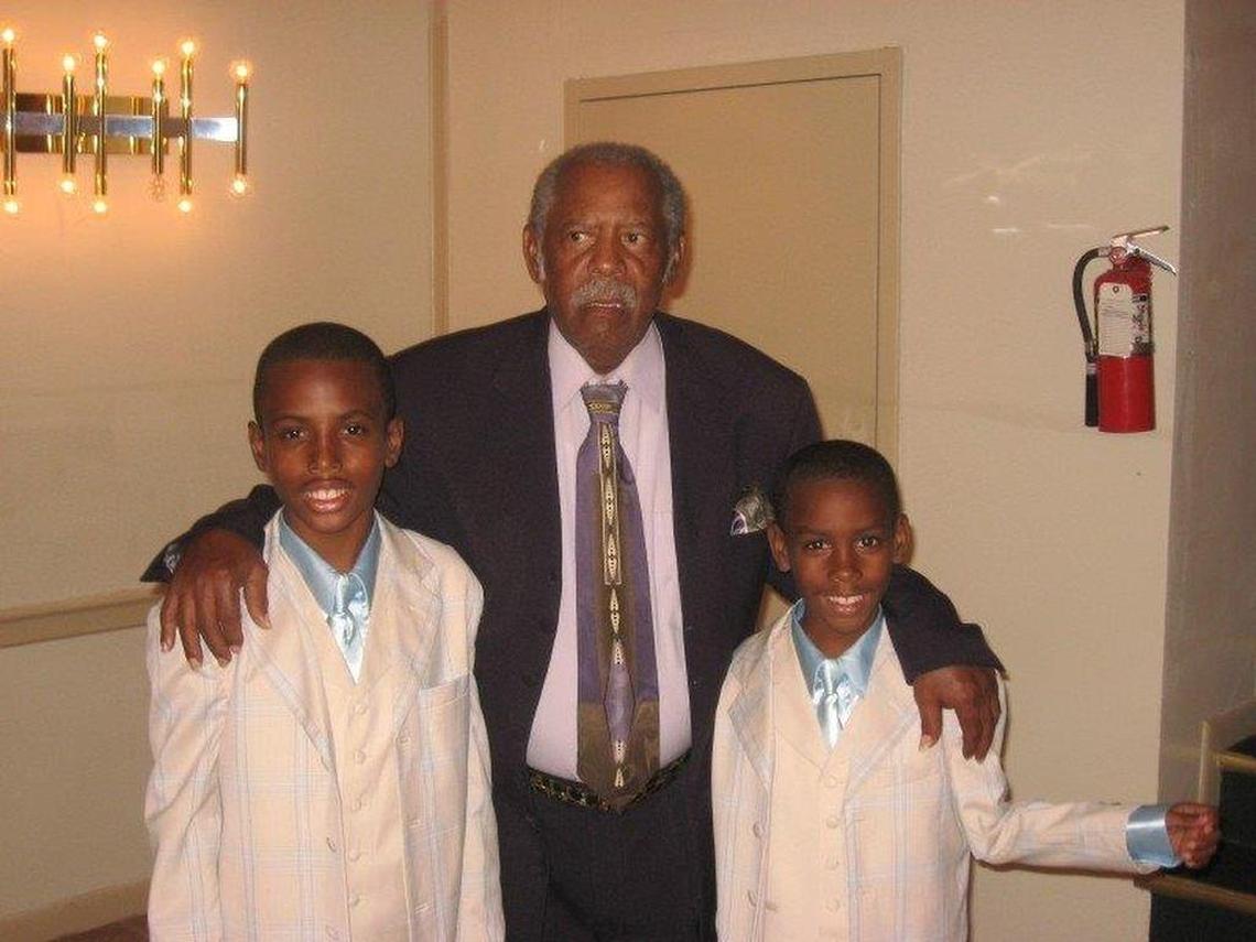 Kato Nelson, left, stands with his grandfather, Rudolph Nelson, and his brother, Roger.