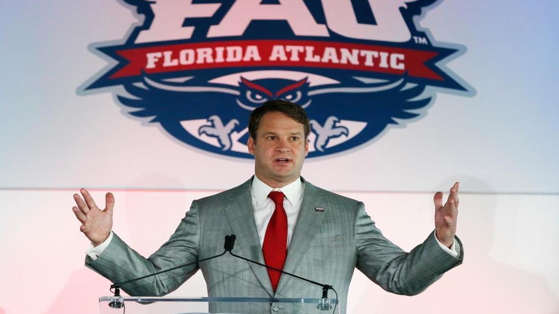 Lane Kiffin gestures as he speaks after being introduced as the new Florida Atlantic NCAA college head football coach, Tuesday, Dec. 13, 2016, in Boca Raton, Fla. Kiffin will return to Alabama to continue running the No. 1-ranked Crimson Tide's offense in the College Football Playoff, which starts Dec. 31 with a semifinal game against No. 4 Washington.