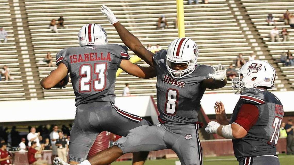 Massachusetts' Andy Isabella, left, and Marqius Young, celebrate Isabella's touchdown catch during the second quarter against Florida International in an NCAA college football game Saturday, Sept. 17, 2016, in Amherst, Mass.