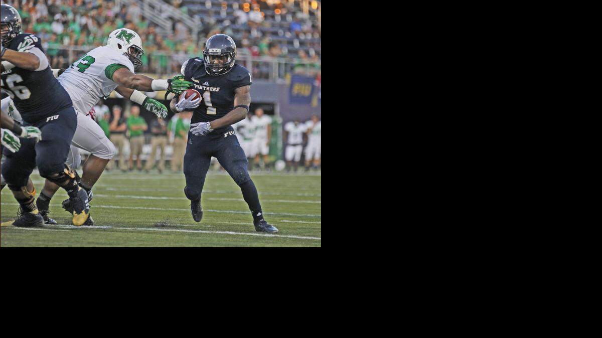 
FIU Panthers running back Alex Gardner (1) rushes to the one yard line as FIU hosts Marshall at Ocean Bank Stadium in Miami on Saturday, October 18, 2014.
