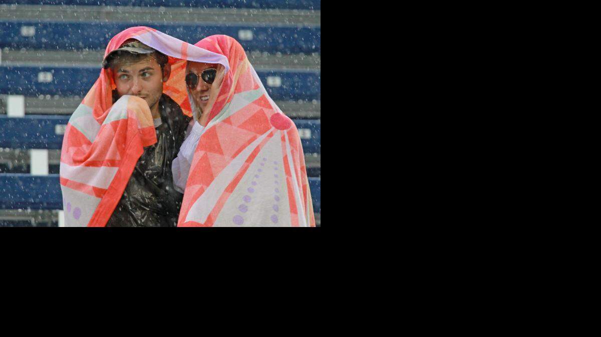
FIU fans watch as they play Louisville in the rain at Ocean Bank Field at FIU Stadium in Miami, Florida, September 20, 2014.

